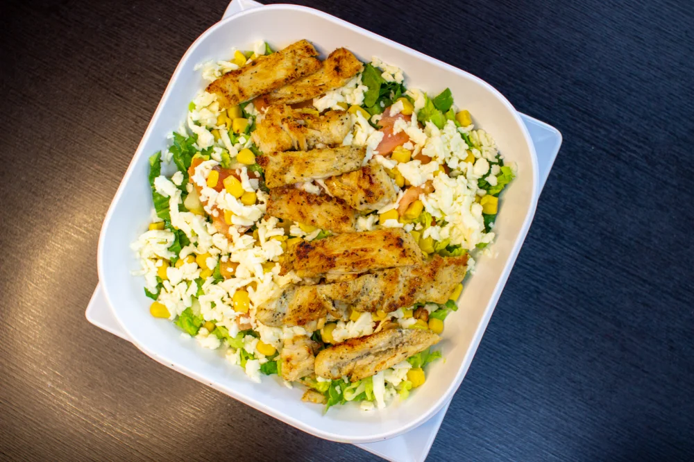 Grill chicken salad on a bed of fresh lettuce